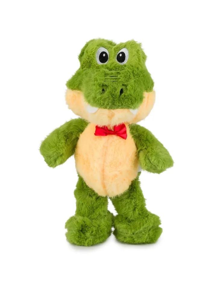Zielony pluszowy krokodyl z żółtym brzuszkiem i czerwoną muszką